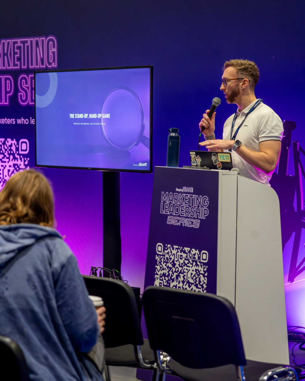 Luke Quilter on stage delivering AI in Action